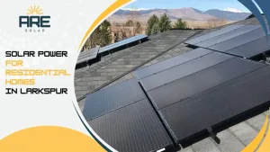 Close-up of black solar panels on a residential roof in Larkspur with scenic mountain backdrop