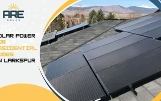 Close-up of black solar panels on a residential roof in Larkspur with scenic mountain backdrop