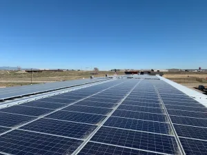 Commercial rooftop solar panel installation in Denver industrial area