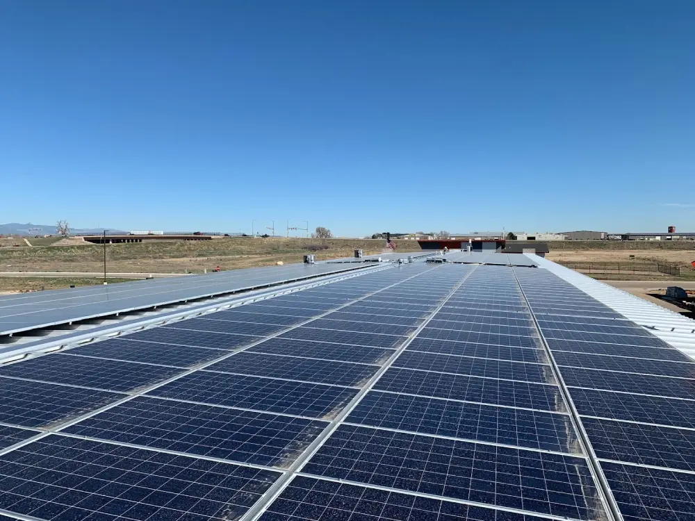 Commercial rooftop solar panel installation in Denver industrial area