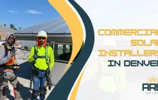 Commercial solar installation crew on a rooftop worksite in Denver