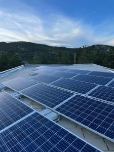 Commercial solar panels with mountain backdrop in Colorado