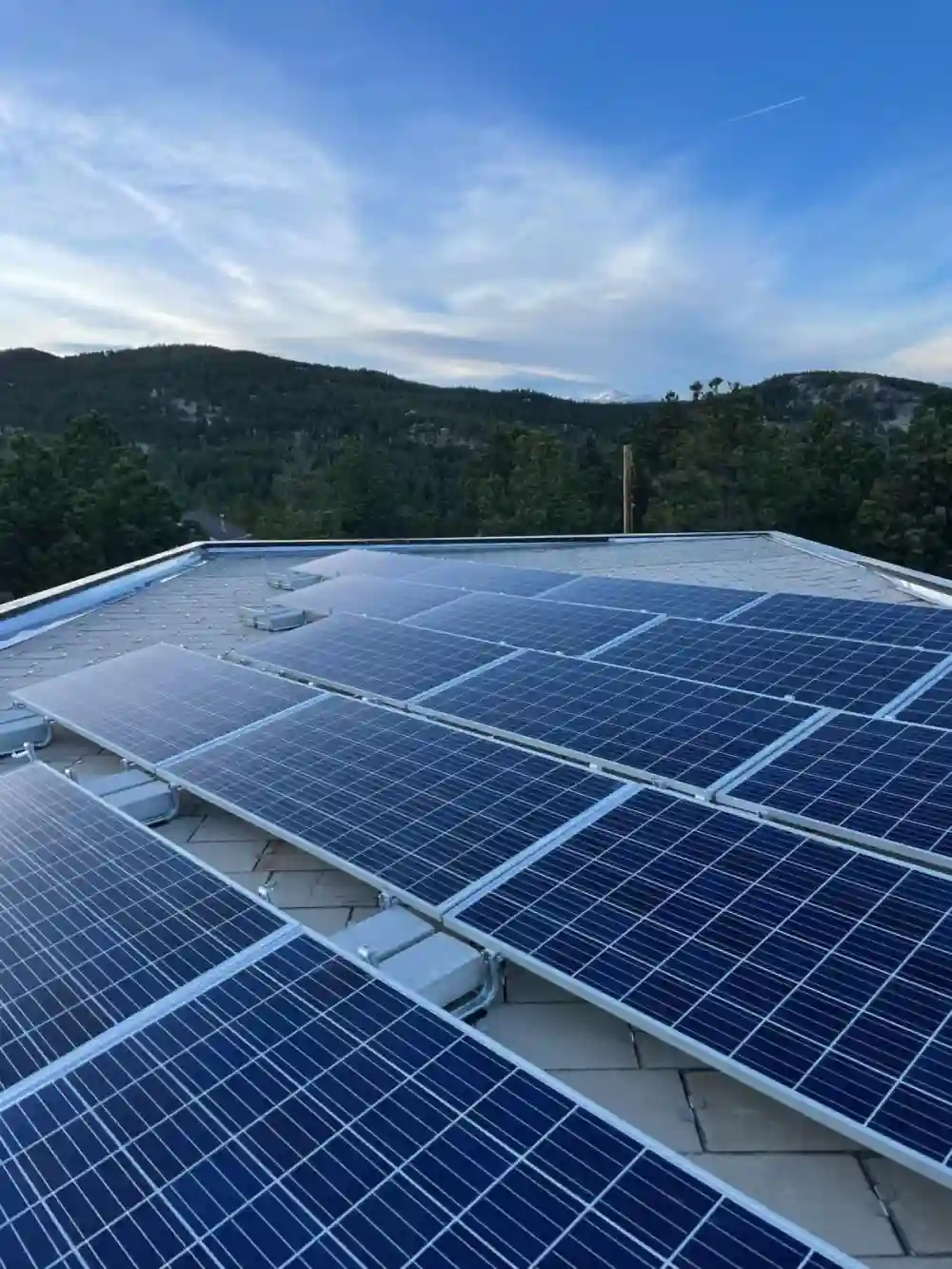 Commercial solar panels with mountain backdrop in Colorado