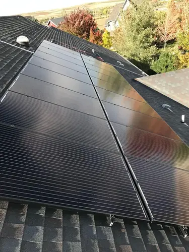 High-efficiency rooftop solar panels on a Larkspur, CO home, showcasing clean energy and modern residential installation