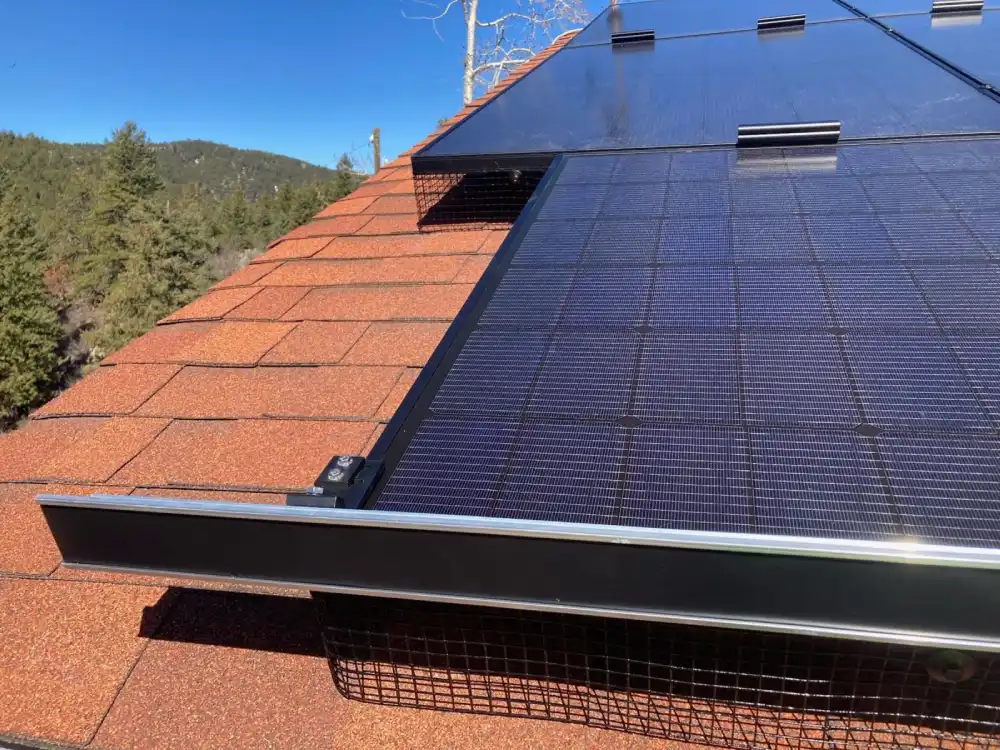 Residential solar panels capturing winter sunlight on a flat roof