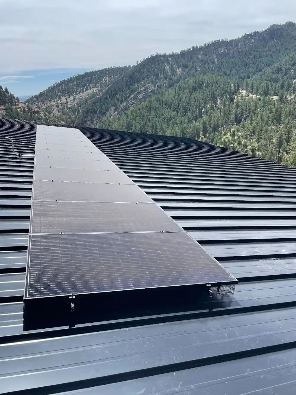 Rooftop solar panel installation in Denver mountain home