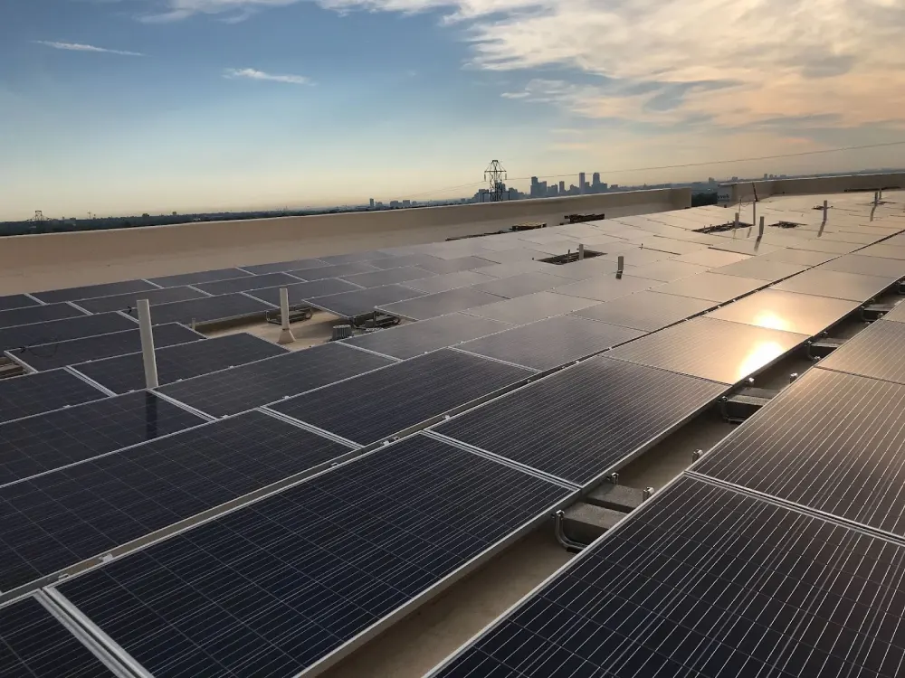 Rooftop solar panel installation in Erie, CO, helping local businesses reduce carbon footprint and energy costs