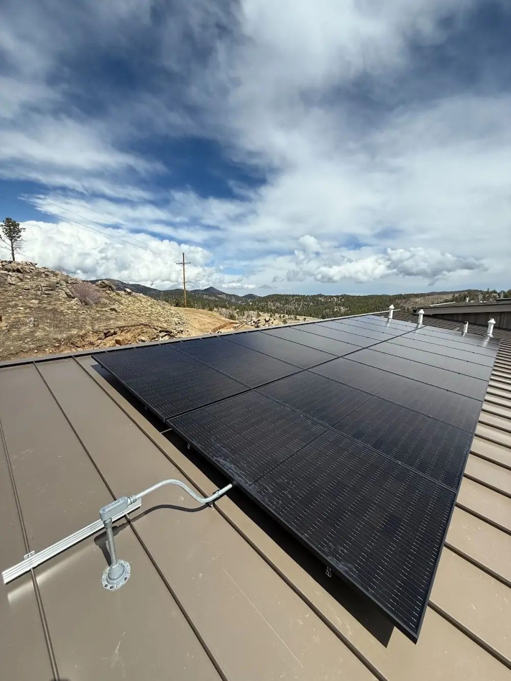 Rooftop solar panel installation in Larkspur with mountain views