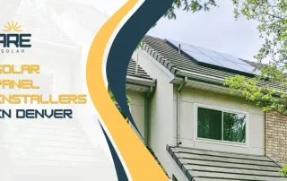 Rooftop solar panels installed on a Denver home surrounded by trees