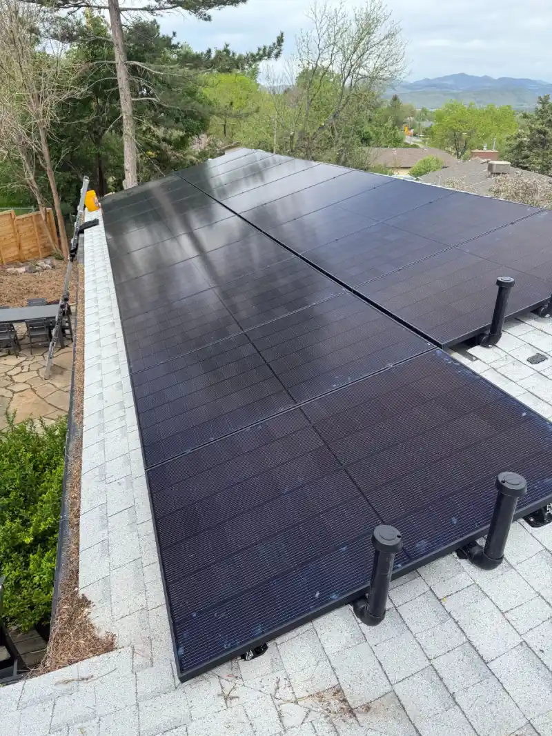 Rooftop solar panels under sunlight promoting Denver solar installation with ARE Solar