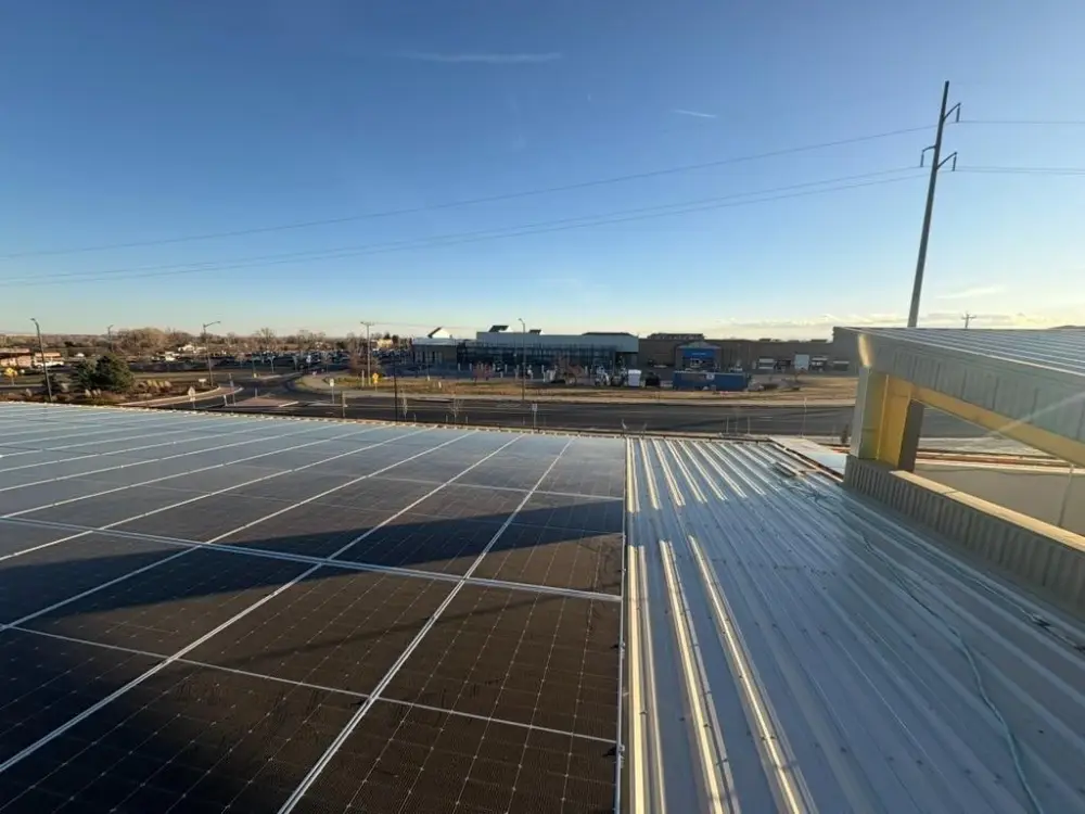 Solar installation on a commercial facility under clear Colorado sky