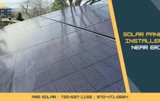 Solar panels installed on a rooftop in Erie under clear daylight