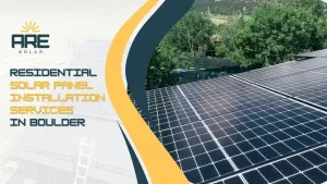 Solar panels on a Boulder rooftop surrounded by greenery, capturing peak summer sunlight