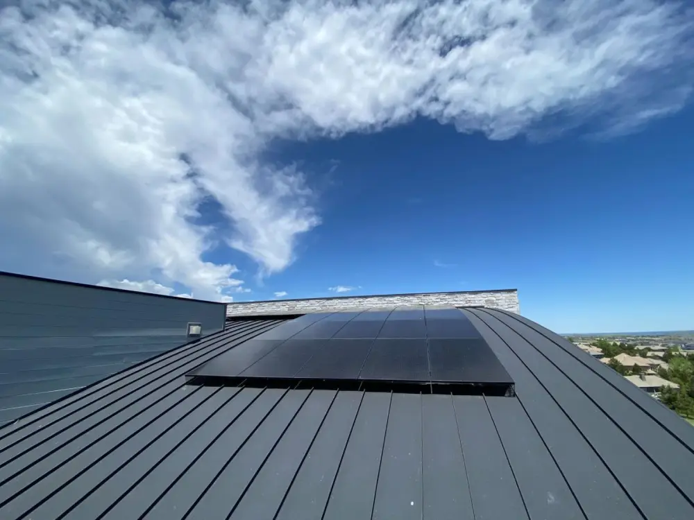 Solar panels on a sloped Denver rooftop designed for maximum sun exposure